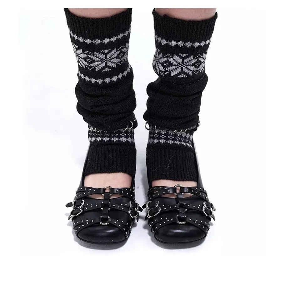 Black women's patent leather buckle pumps with a square toe and flat rubber sole.