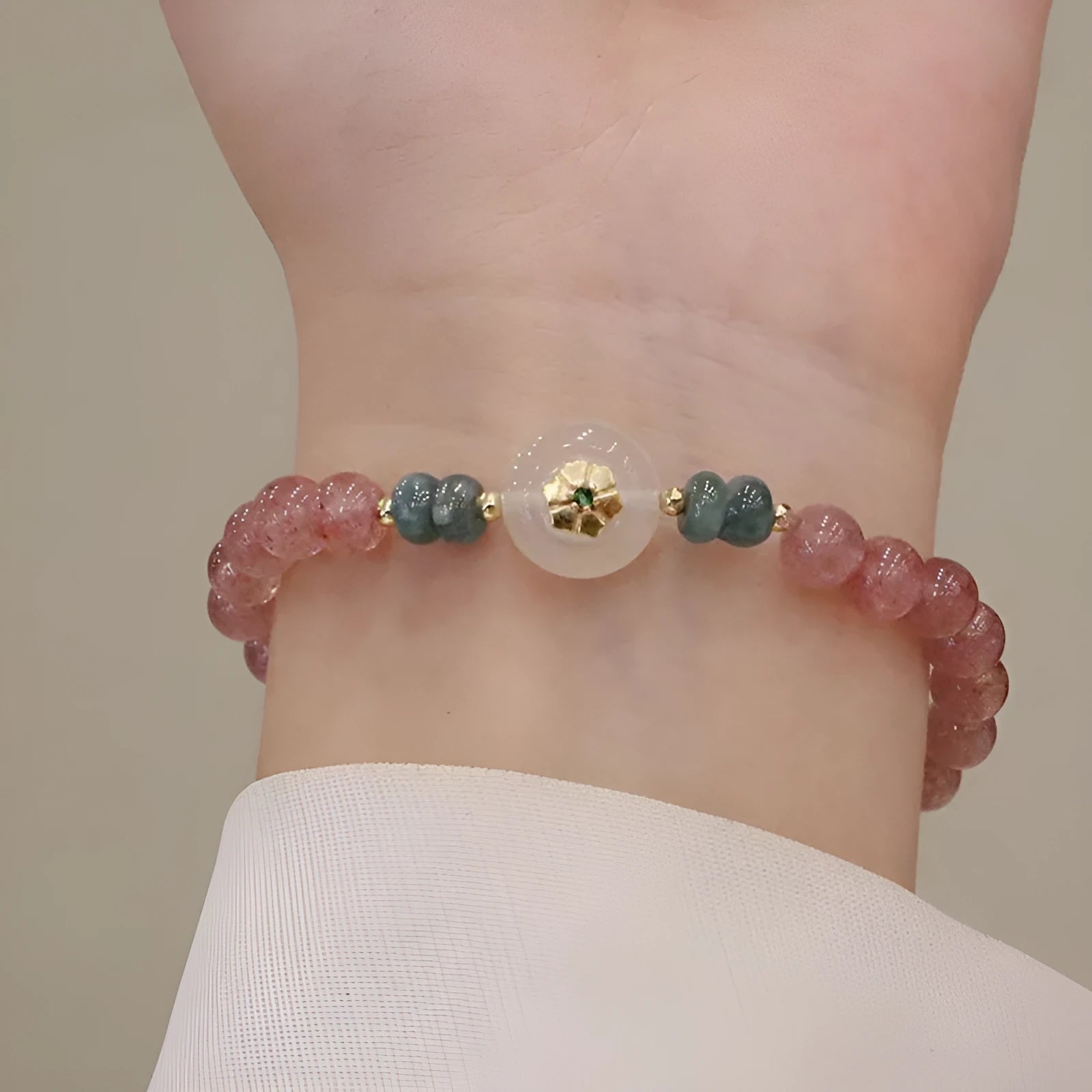 Women's strawberry quartz blue water emerald jade bracelet with geometric design and Ruyi peace buckle closure