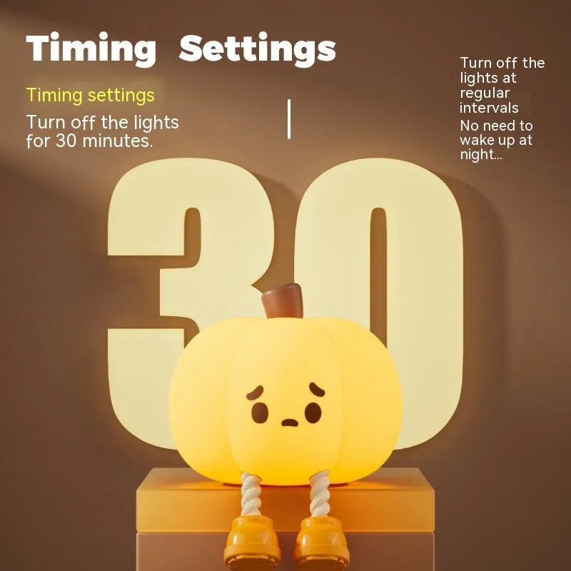 Soft orange silicone pumpkin-shaped night light with a gentle glow, sitting on a surface.