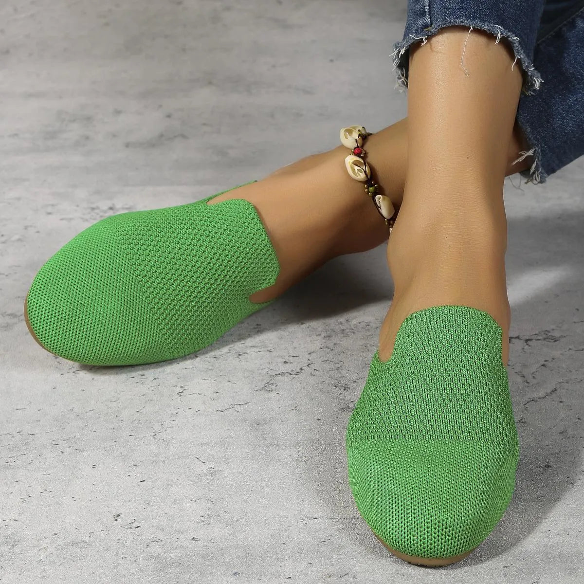 Apricot, blue, and green mesh slip-on sandals with round toe and flat rubber sole.