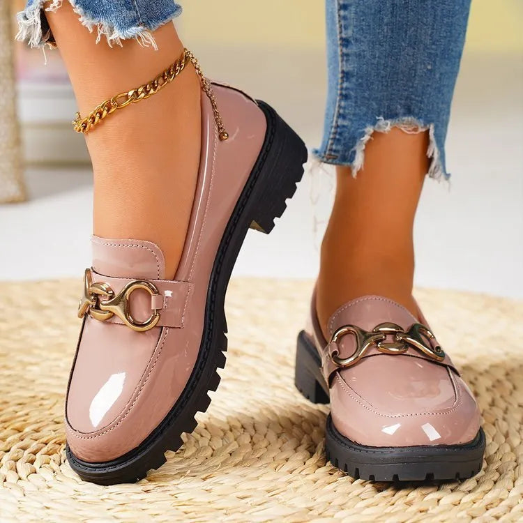 Women's black chunky heel round toe pumps with thick rubber sole and metal decoration
