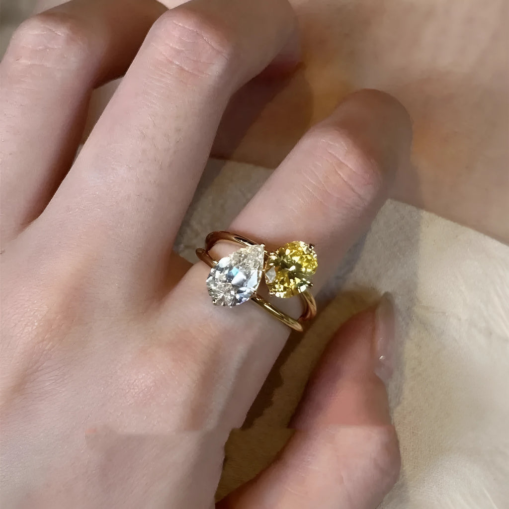 Geometric open fashion ring in copper with a single water drop zircon stone.