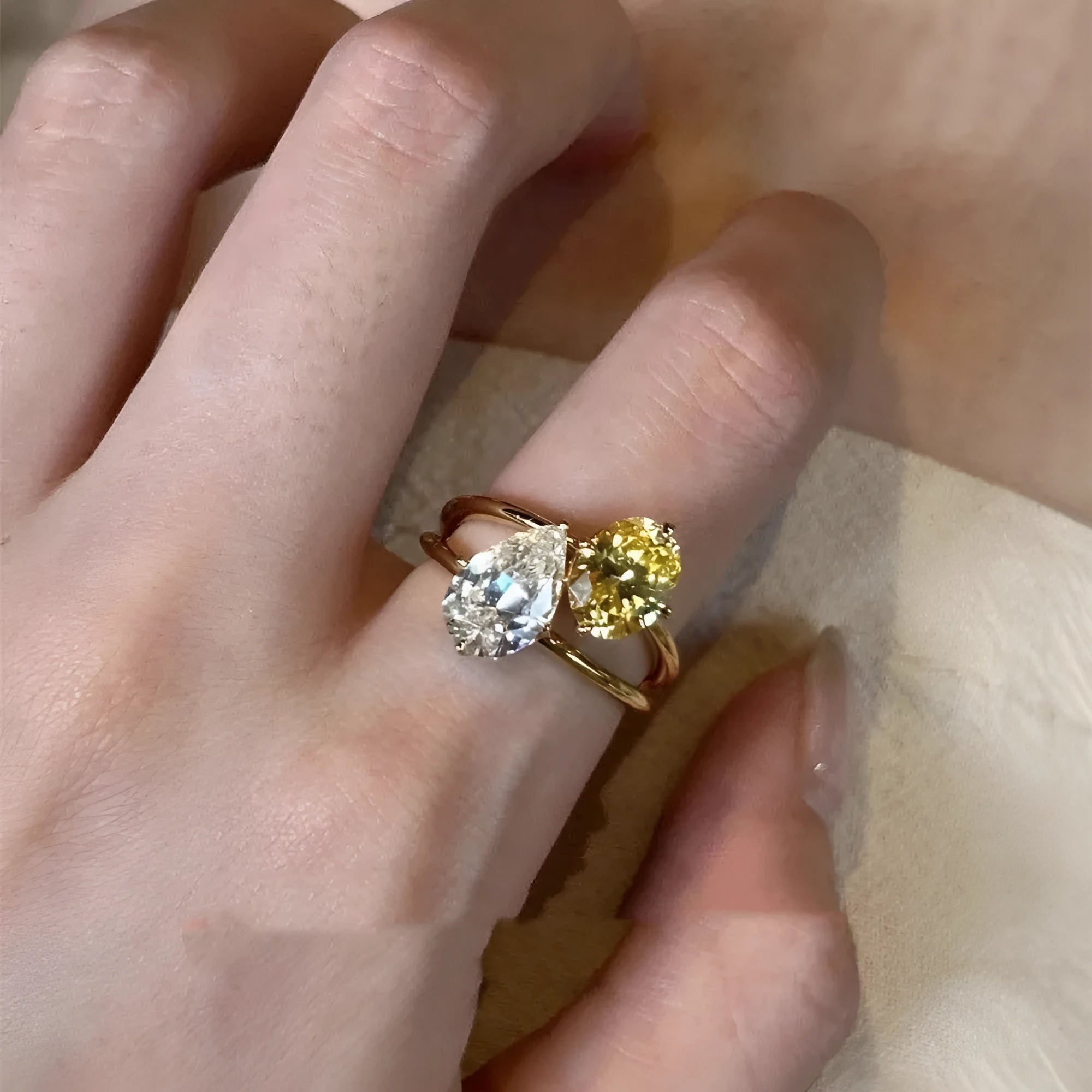 Geometric open fashion ring in copper with a single water drop zircon stone.