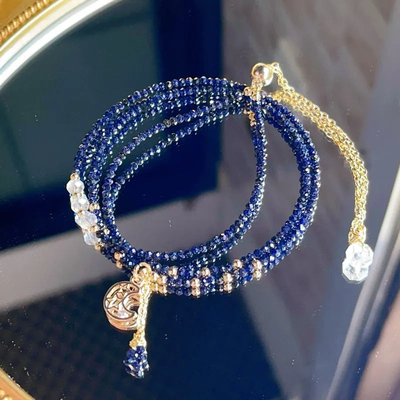 Women's blue sand stone bracelet with three gold-coloured rings in multi-layer design