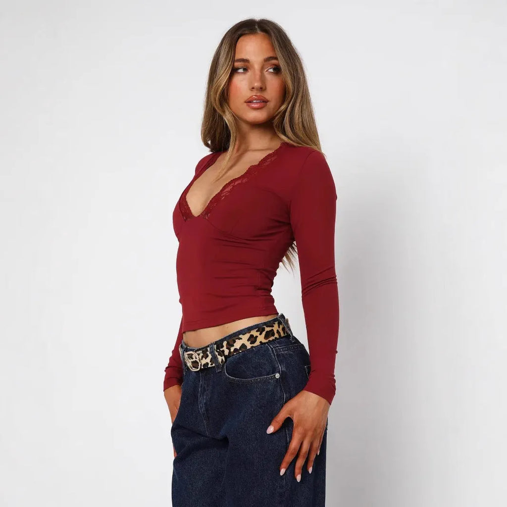 Women's slim fit pullover top with lace flower shoulder detailing in black or wine red