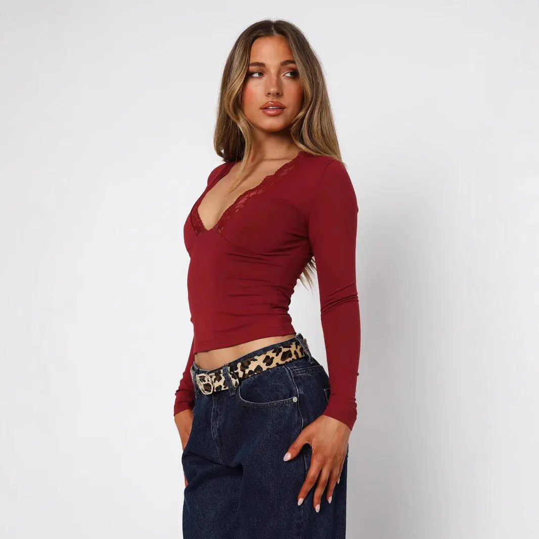 Women's slim fit pullover top with lace flower shoulder detailing in black or wine red