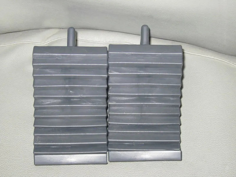 Pair of triangular car wheel stoppers in black colour with storage boxes