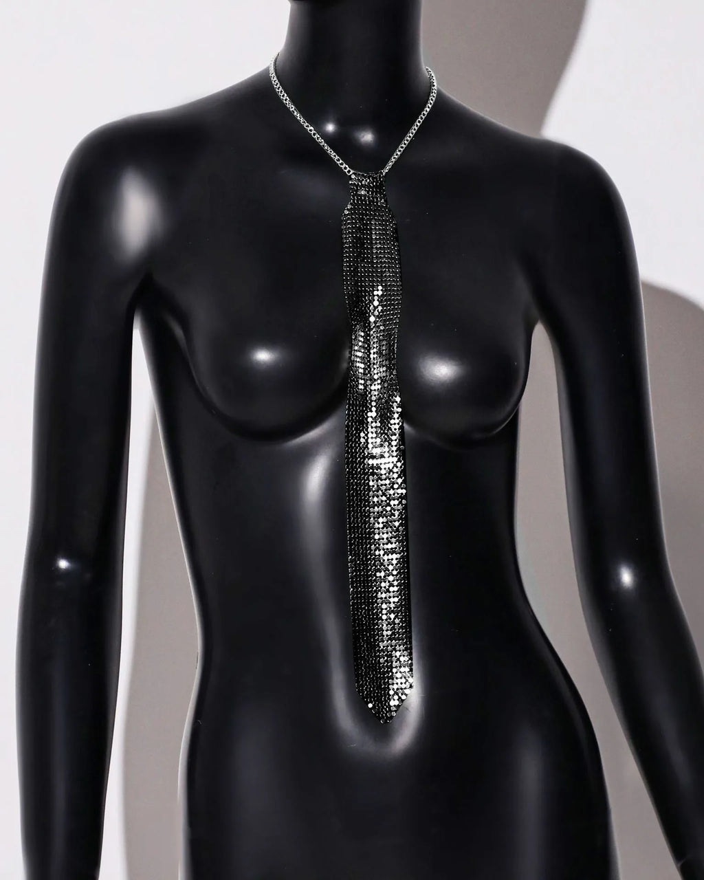 Silver metal sequin arrow-style bow tie for adult party and festival wear.