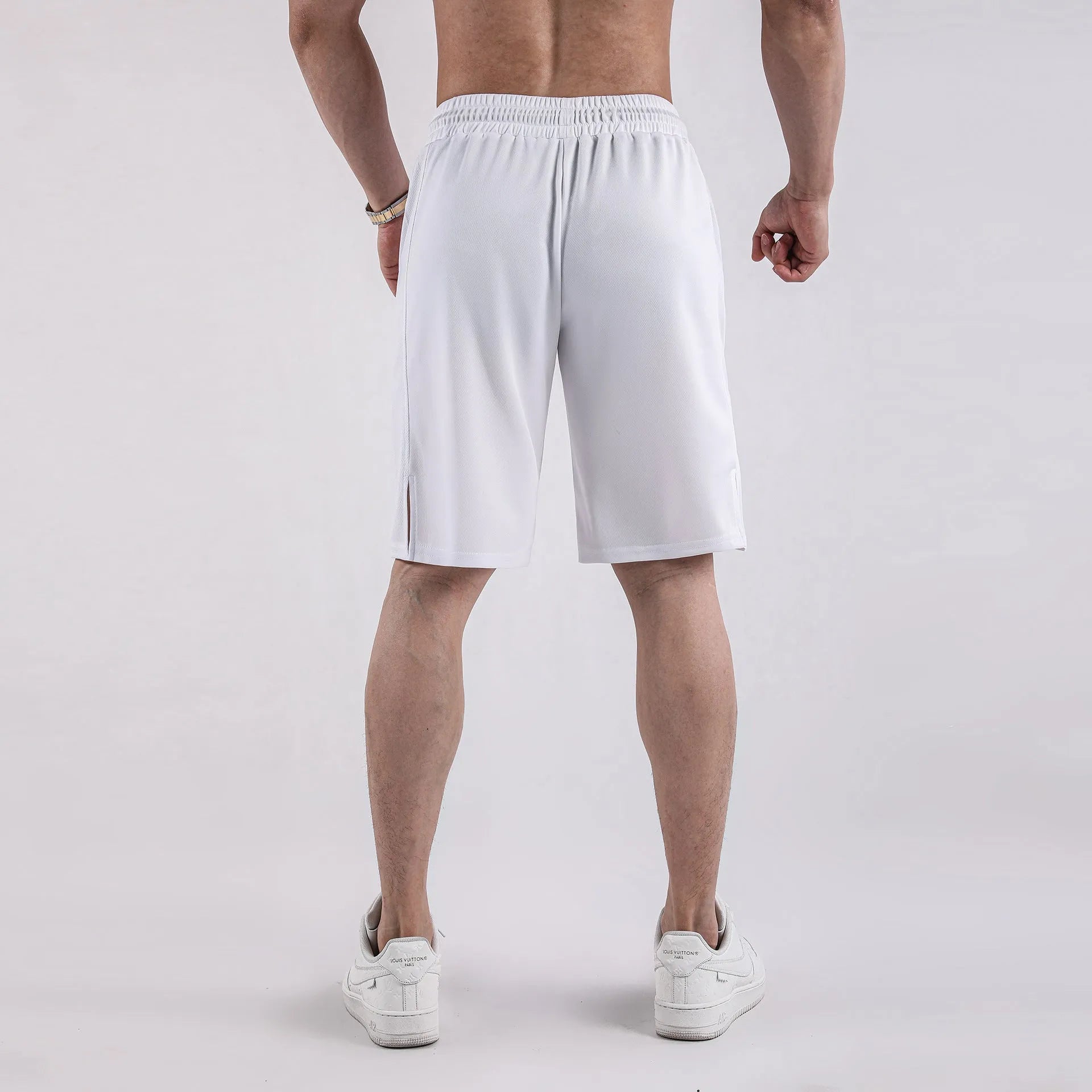 Men's black loose-fit quick-drying mesh casual shorts on a white background.