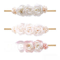 Set of three cloth flower-shaped baby hair bands in different styles