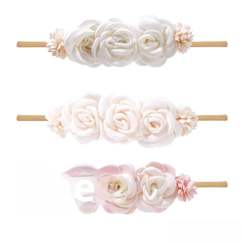 Set of three cloth flower-shaped baby hair bands in different styles