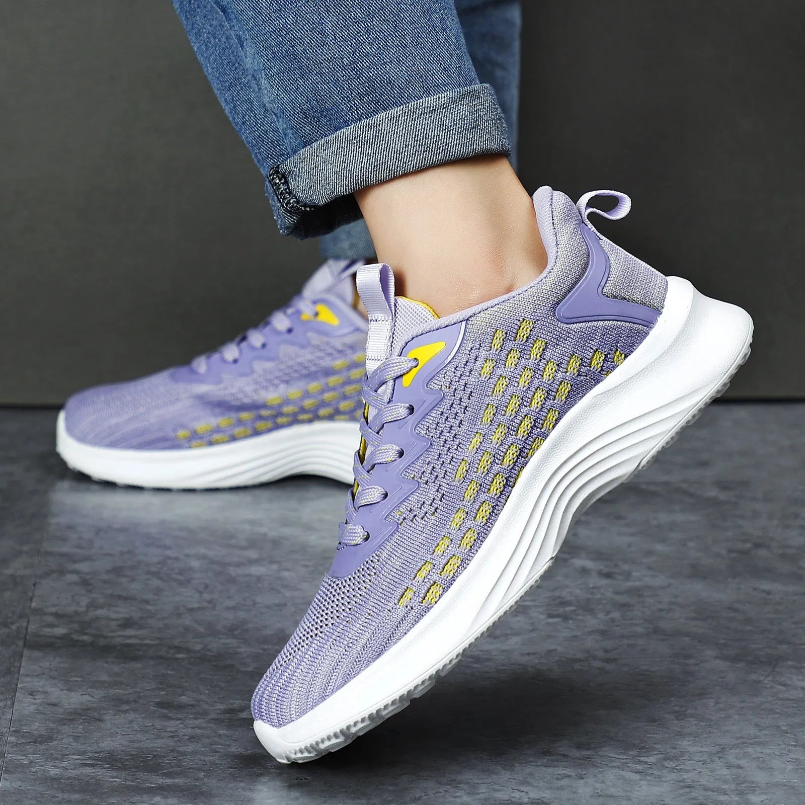Women's lavender purple and sapphire blue Flyknit running shoes with striped pattern and mesh lining