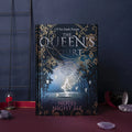 Blue and purple luminous hardcover A5 notebook with full-colour illustrated pages open.
