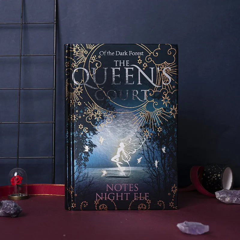Blue and purple luminous hardcover A5 notebook with full-colour illustrated pages open.
