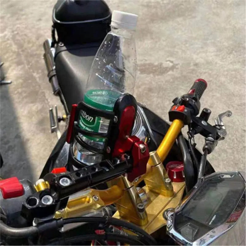 Black modified water bottle cage mounted on a Honda X-ADV scooter.