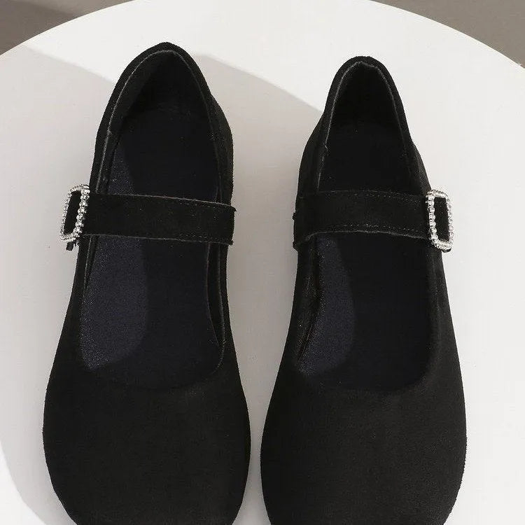 Women's solid black low-top canvas fisherman shoes with a flat rubber sole.