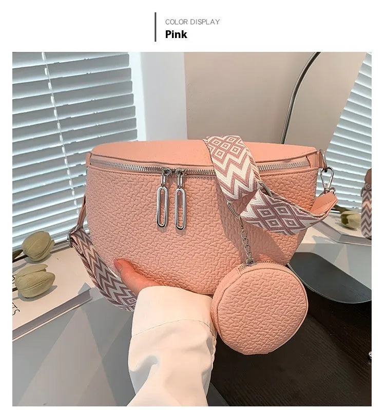 Solid colour women's crossbody bag with textured saddle lock zipper detail in a horizontal square shape