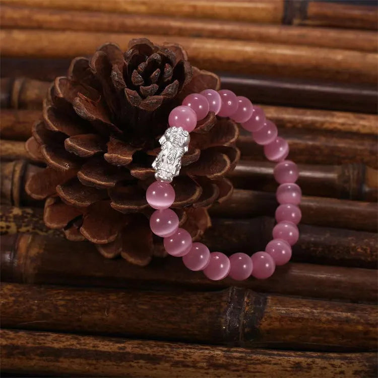 Natural crystal stone powder cat eye bracelet in pink, hand-woven with silver-coloured material, 260g