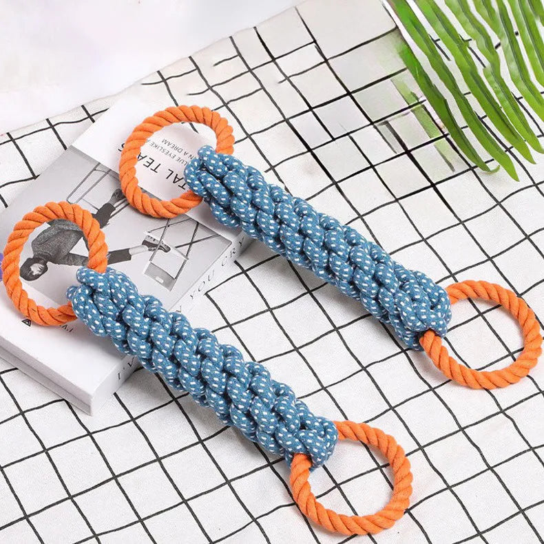 Blue braided cotton rope bone dog toy with double rings at each end for chewing and tooth cleaning