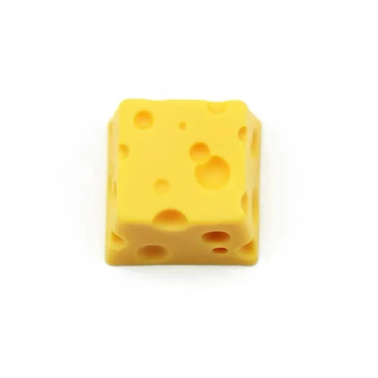 Yellow solid resin cheese wedge keycap for MX mechanical keyboards.