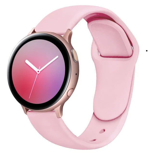 Samsung Galaxy Active 2 watch with a purple reverse buckle silicone strap on a wrist.