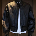 Men's extended length black PU leather jacket with egg white litchi grain texture and slim fit styling