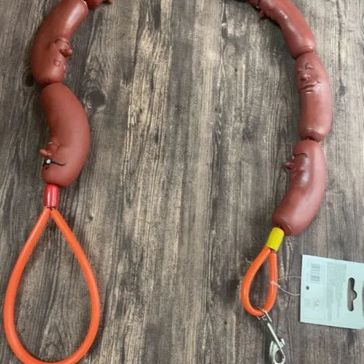 Brown fabric cat play rope with sausage-shaped sections and a grip tape handle, shown at full 108cm length.