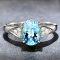 Women's court ring with heart-shaped natural zircon in red, blue, green, or light blue on a metal band.