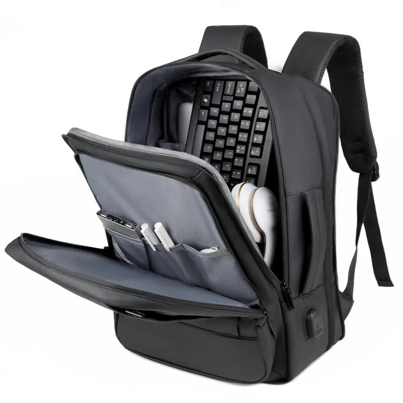 Large black waterproof backpack with curved shoulder straps for business travel and commuting