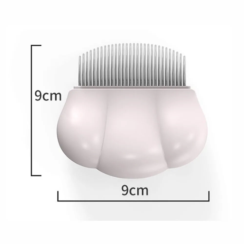 Paw Soft deshedding grooming brush for cats and dogs on a white surface.