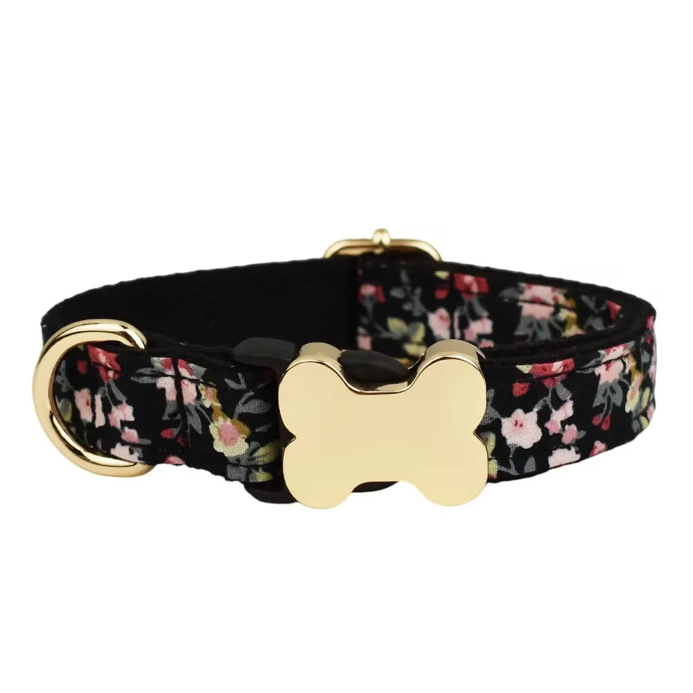 Nylon dog collar with a printed grid pattern and a large bone-shaped metal buckle.