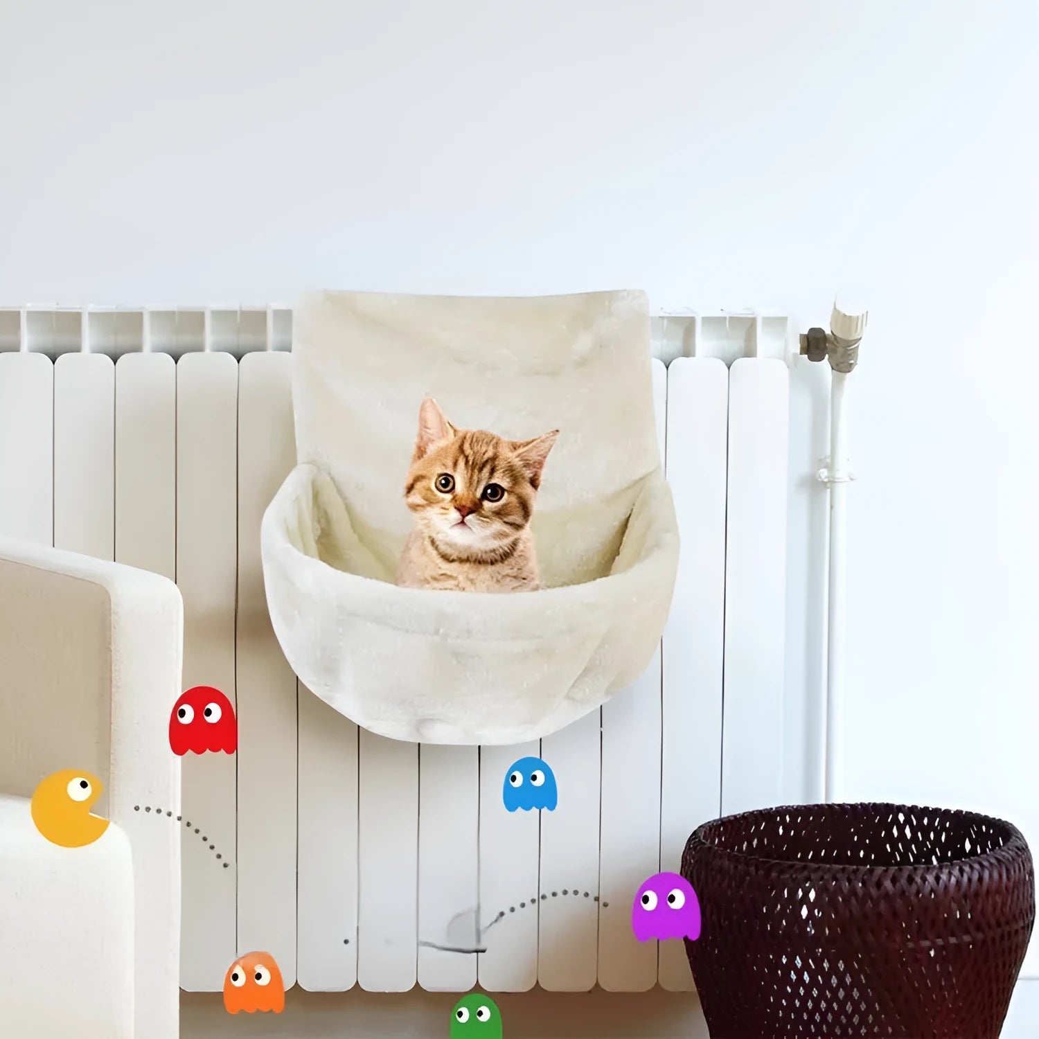 Iron frame cat hammock with soft fleece lining in grey, attached to a cage for a small cat.