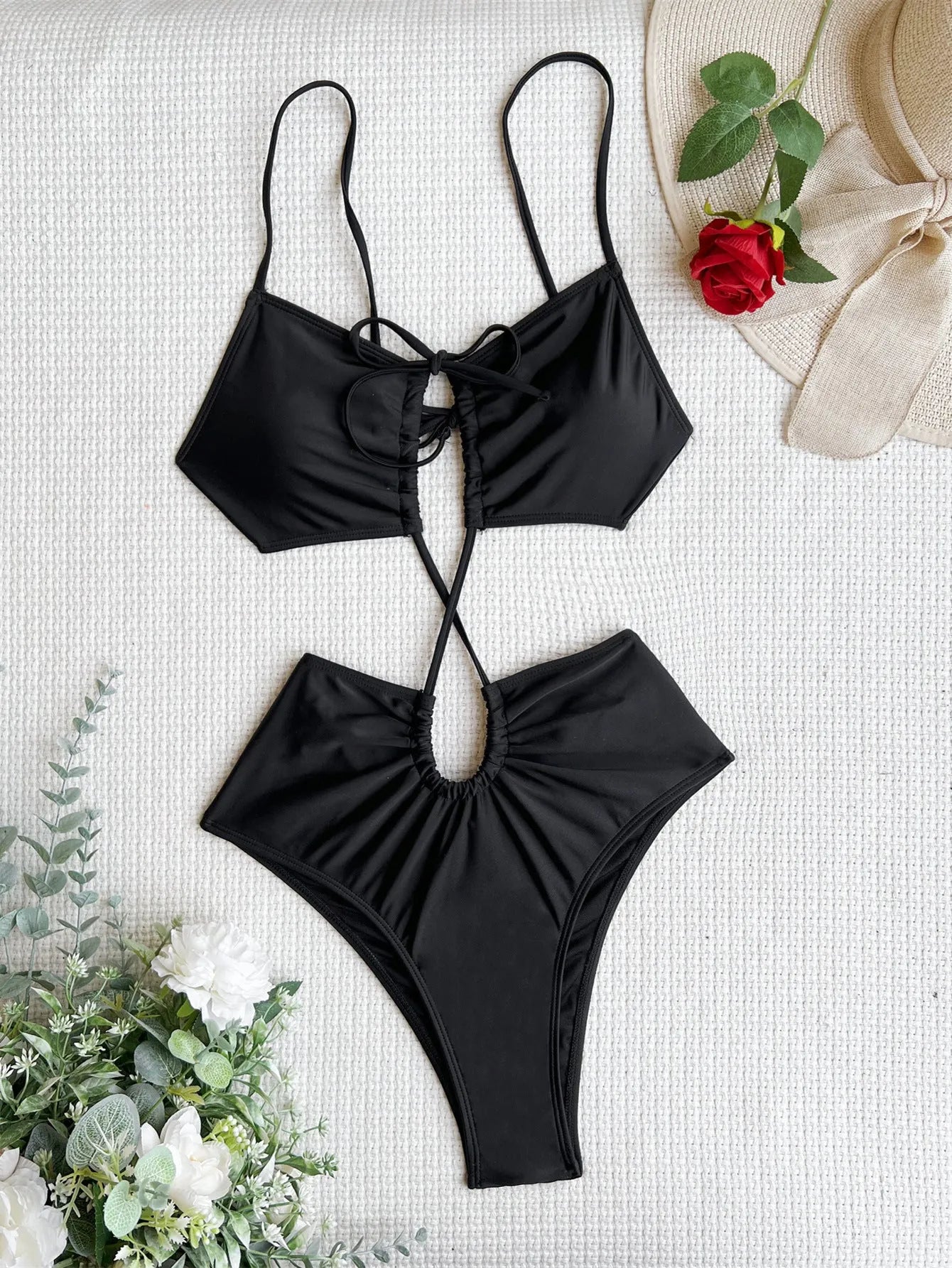 Sleeveless green one-piece swimsuit for women featuring a hollow cut-out design detail on the front.