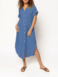 Loose-fitting mid-length casual dress with button front detail on a hanger.