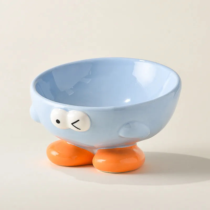 Cute Expression tall slanted ceramic pet food bowl in blue and yellow colours for cats and dogs