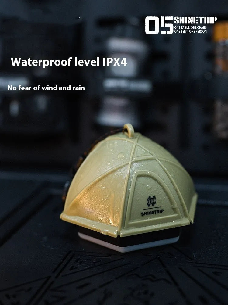 Camping tent light with analog brightness dial in dark green, Warhawk Sand or slightly smoky grey colour options