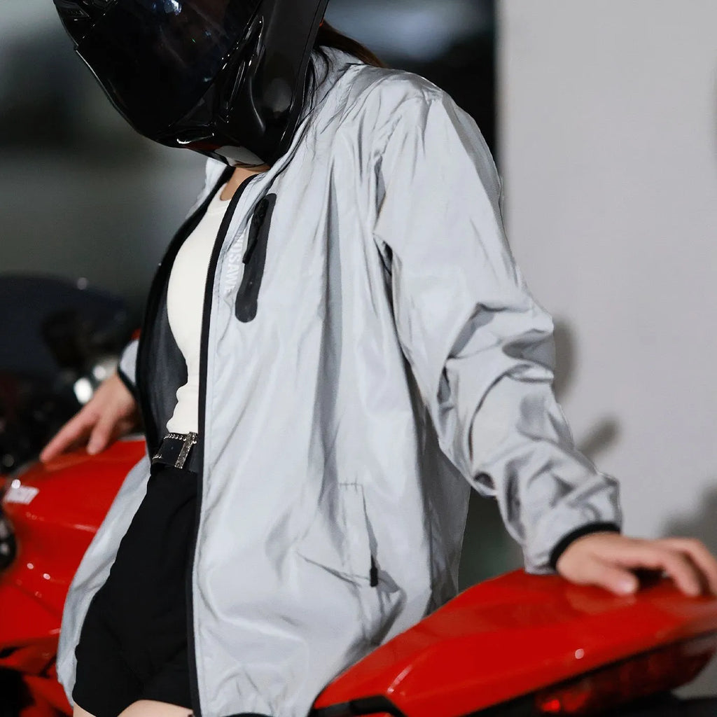 Silver waterproof polyester long sleeved windproof jacket for outdoor activities.