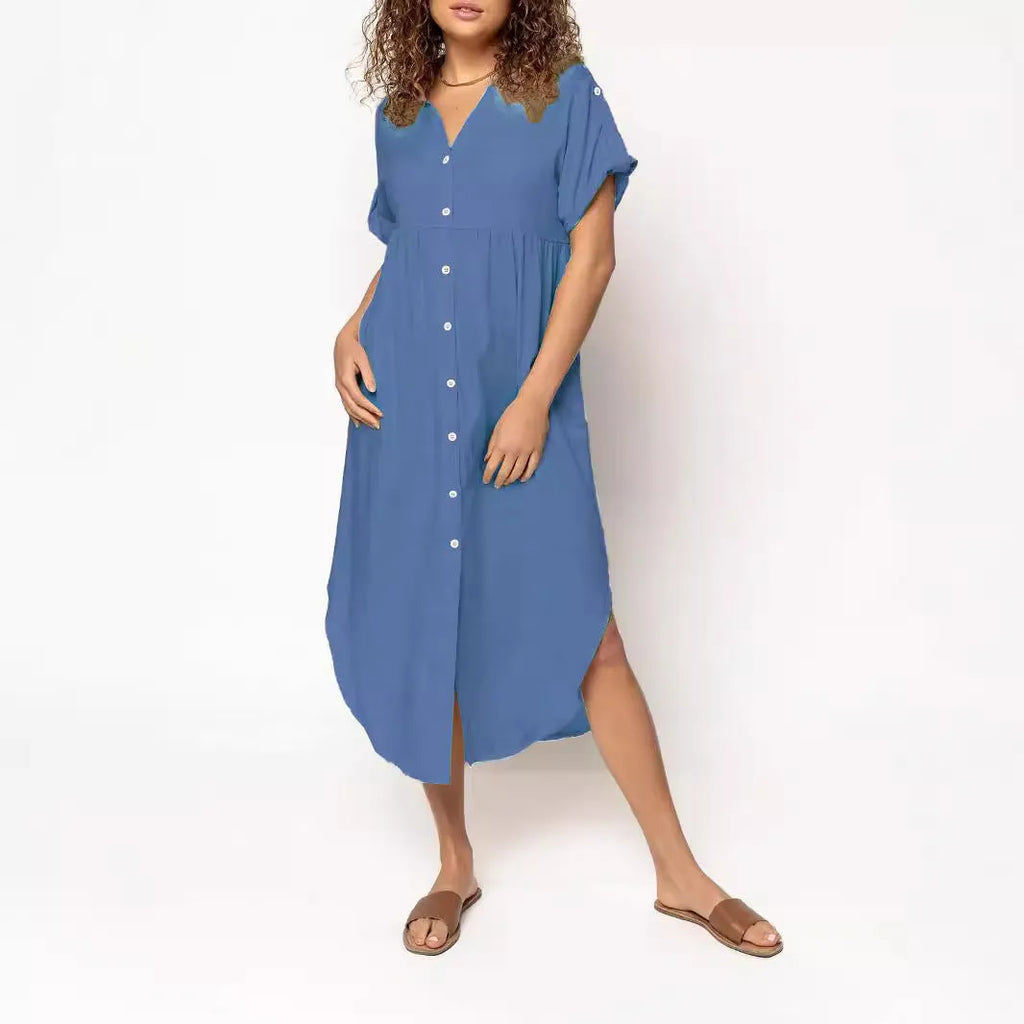 Loose-fitting mid-length casual dress with button front detail on a hanger.