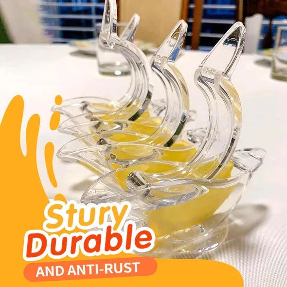 Transparent acrylic bird-shaped manual lemon juicer on a kitchen counter.