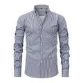 Man wearing a blue striped non-ironing business casual shirt with a lapel collar.