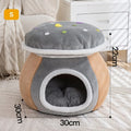 Grey mushroom-shaped enclosed cat bed with plush interior and a detached matching blanket on a wooden floor.