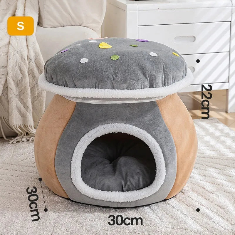 Grey mushroom-shaped enclosed cat bed with plush interior and a detached matching blanket on a wooden floor.