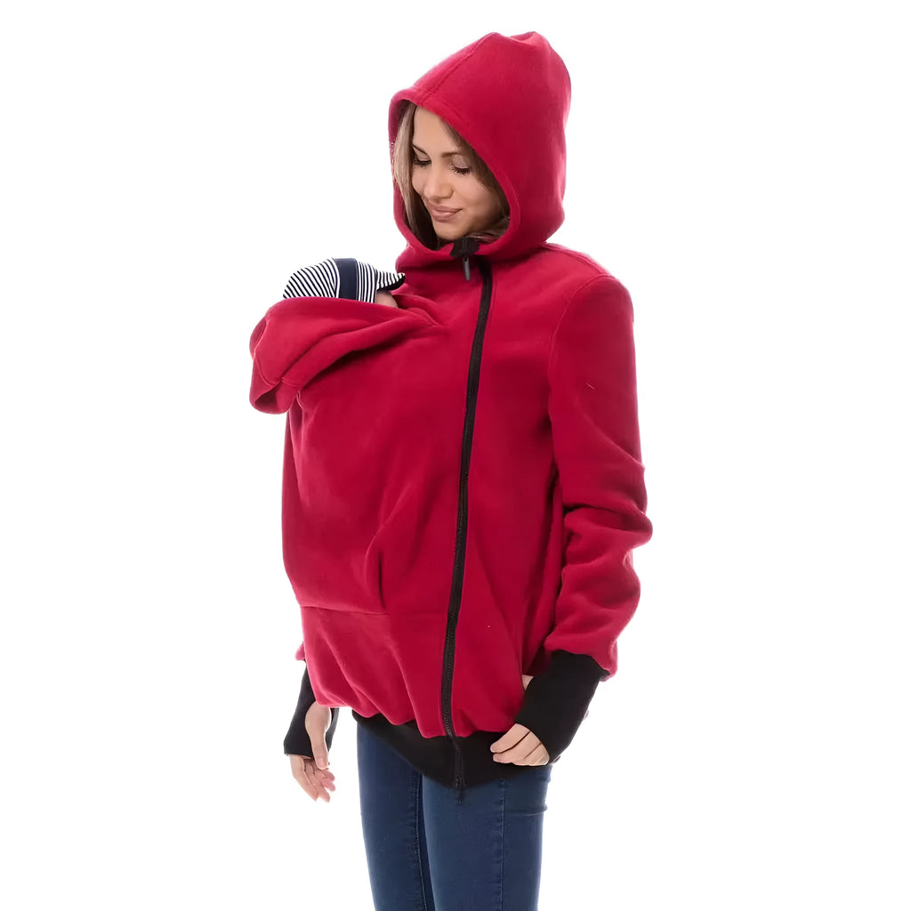 Red loose-fit polar fleece women's sweater with long sleeves on a hanger.