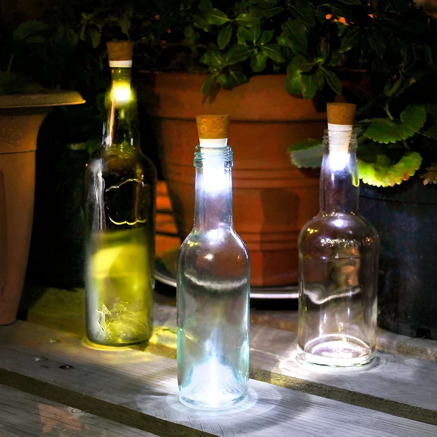 White plastic USB-rechargeable LED cork light for bottle decoration, showing compact size.