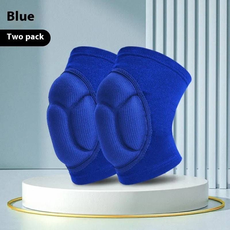Black and blue pair of thick sponge knee pads for sports protection on a neutral background.