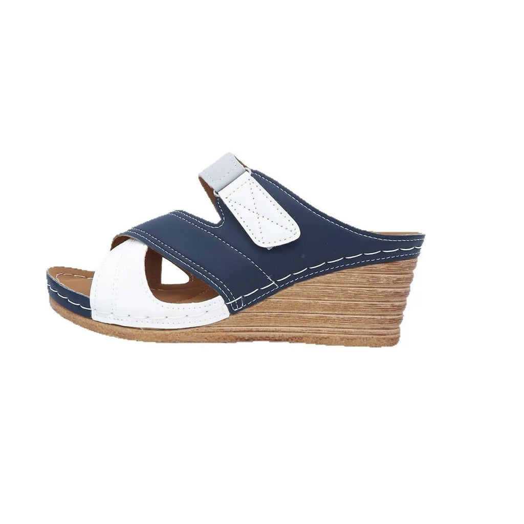 Women's platform wedge slipper with Velcro strap in a two-tone colour, showing fish mouth toe design.