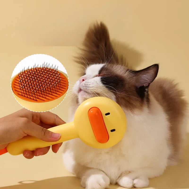 Small yellow duck-shaped pet comb for cat and dog grooming with open-section needle design