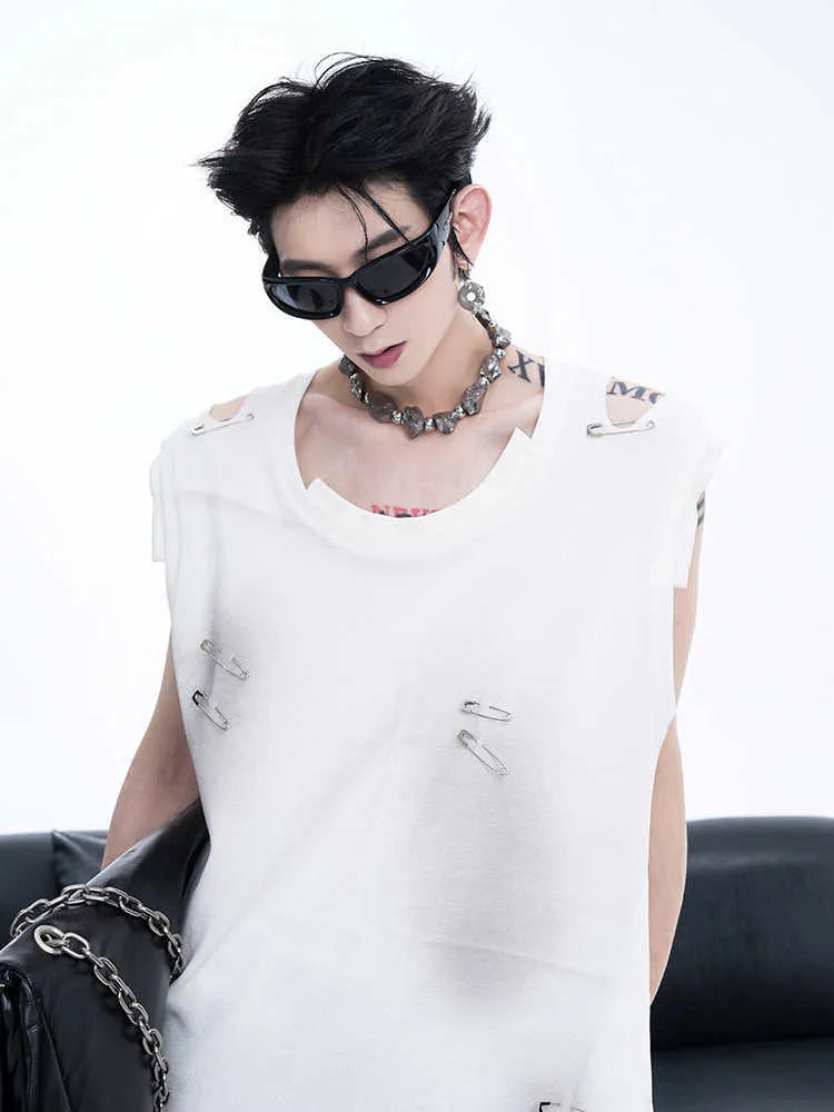 Man's black ripped irregular sleeveless vest t-shirt with asymmetric hem on a plain background.