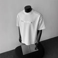 Men's loose-fit cotton short sleeve pullover shirt with letter print in black, white, or light grey