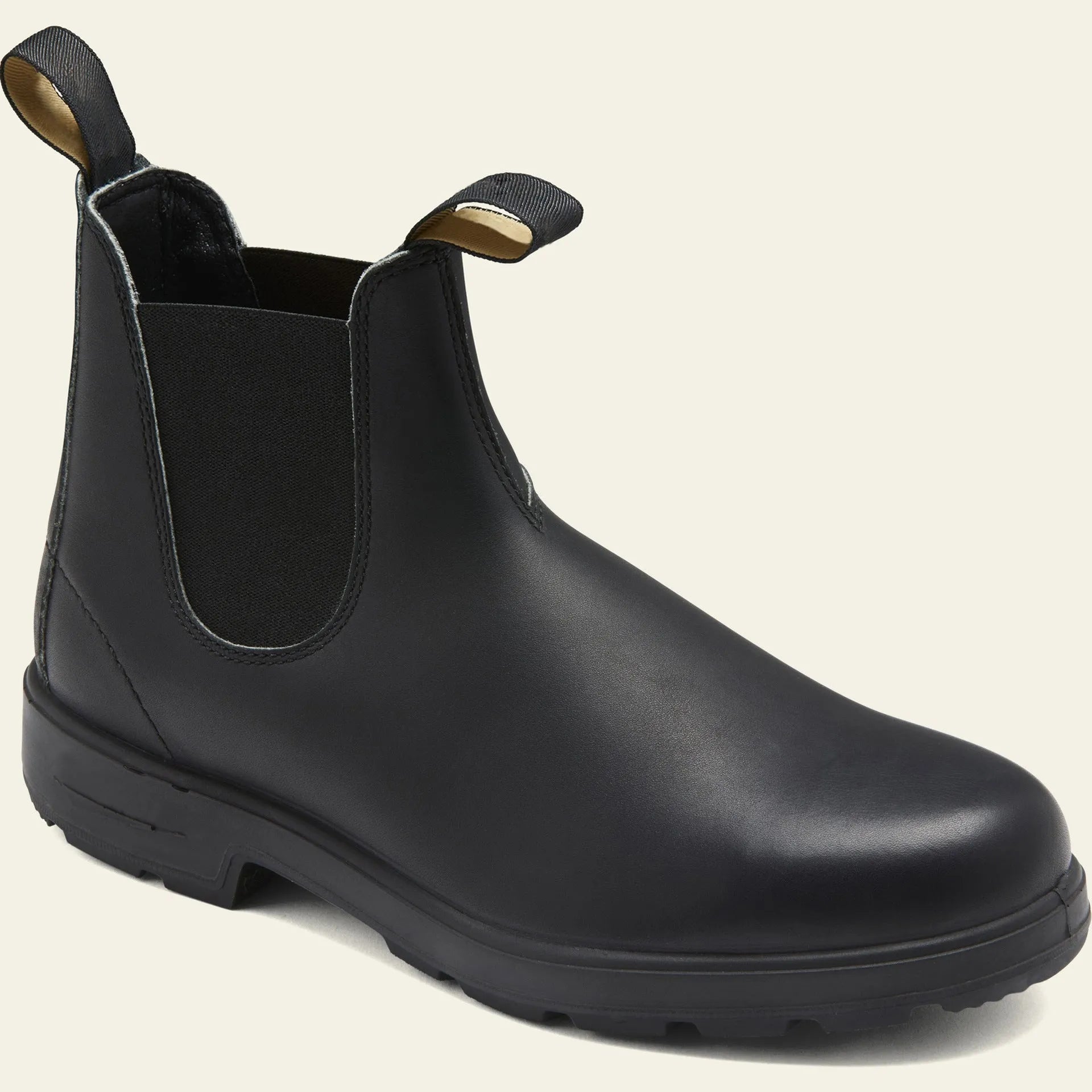 Vintage brown Chelsea boot with frosted PU upper, round toe, and mid-calf height on a wooden surface.